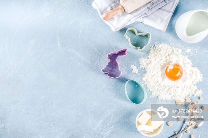 Easter baking culinary background with ingredients and props, on a light blue concrete background top view copy space