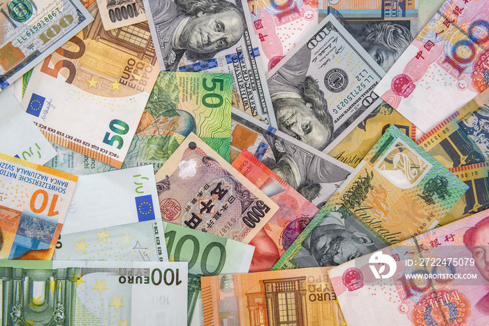 Colorful banknotes of different countries as background close up