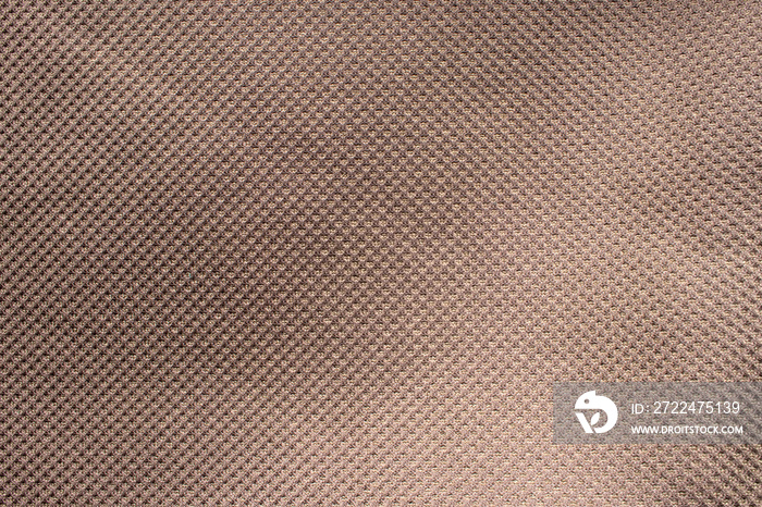 Durable waterproof fabric. Ripstop fabric. Close-up brown ripstop material texture and background.