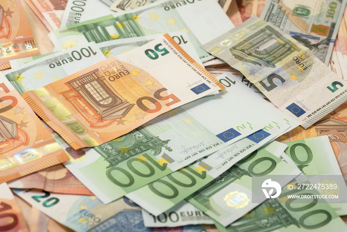 Background of dollar, euro banknotes on a table