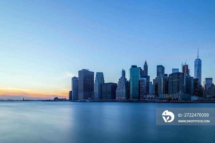 new york city skyline at dawn