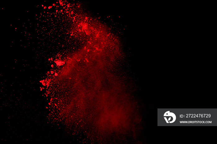 Abstract Red powder splatted background,Freeze motion of red powder exploding/throwing green dust.