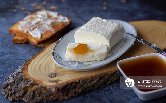 Clotted cream (butter cream) for Turkish breakfast - Kaymak, honey and glass of milk