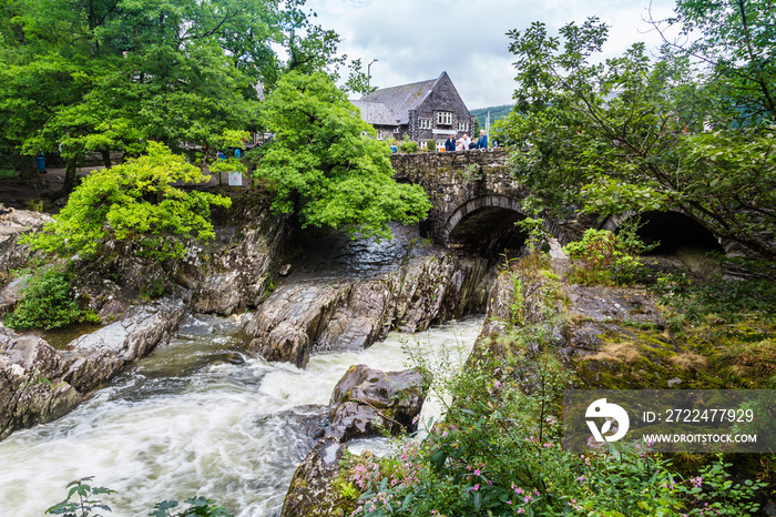 Traditional bridge and rapids of  Betws-y-Coed town in Snowdonia National Park in  Wales, UK