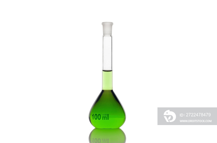 Volumetric flask with green liquid on white background