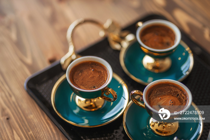 freshly brewed hot turkish coffee on the table. treating customers with coffee in the office for the sale of apartments in Turkey. black strong coffee in istanbul