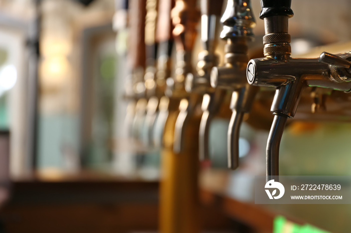 Draft beer taps in modern bar