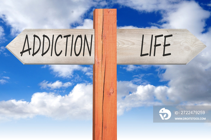 Addiction or life - wooden signpost