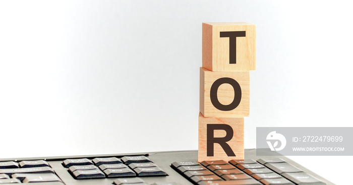 TOR word written on wood block. TOP text on keyboard for your desing, Top view concept