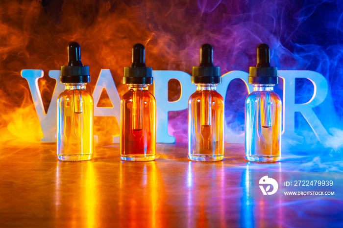 Vape. Vapor. Steam from vape. Bottles with vape liquid. Vape concept. VAPE is written in large letters