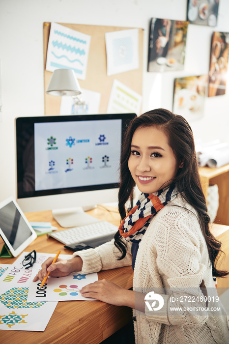 Asian graphic designer working on new project in office