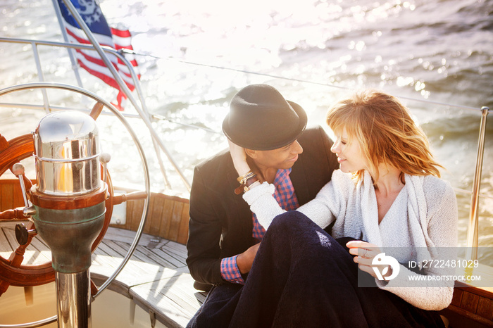 Young couple relaxing on yacht