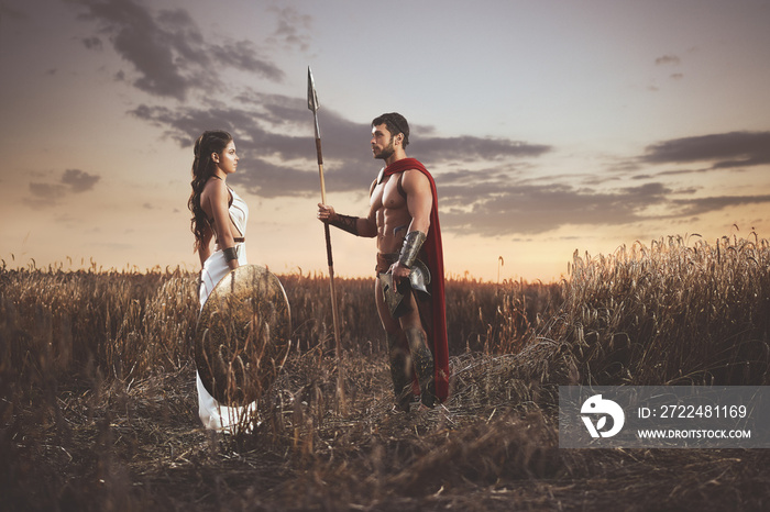 Couple meeting after war in field, looking each other.