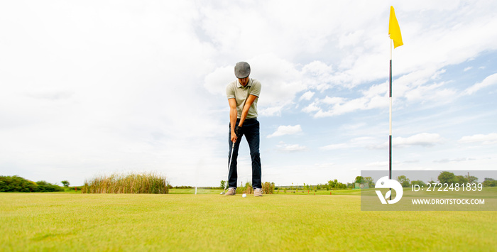 Young man playing golf