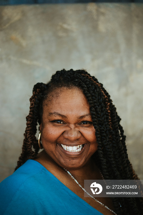 closeup portrait of a smiling plus size afro latinx haitian american woman