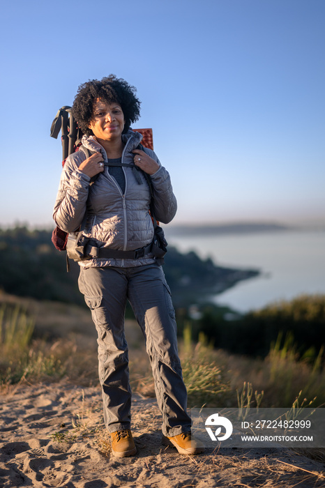 U.S. Army female soldier putting in the miles with an early morning hike in the NorthWest.