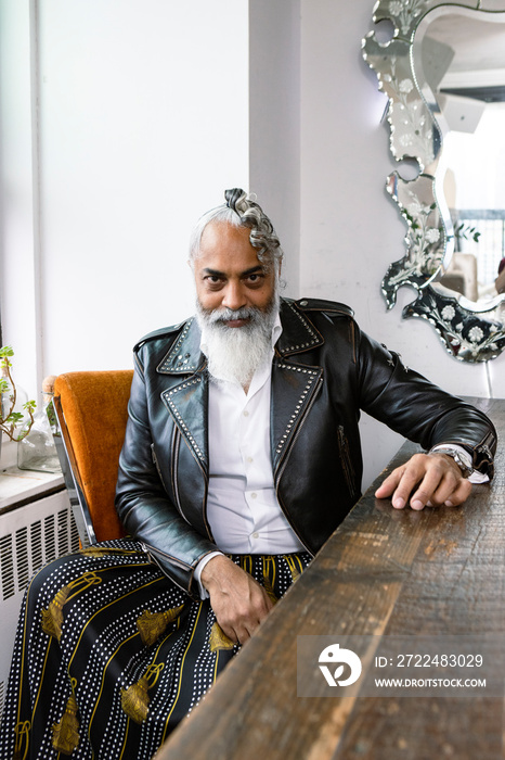 sitting portrait of man with grey beard