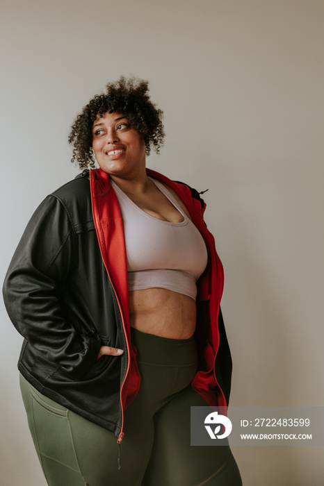 portrait of a plus size afro indigenous person wearing workout gear