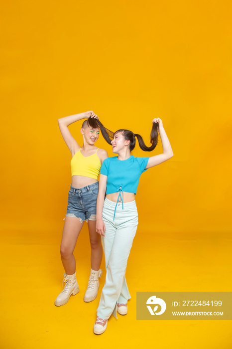 Studio portrait of smiling stylish friends