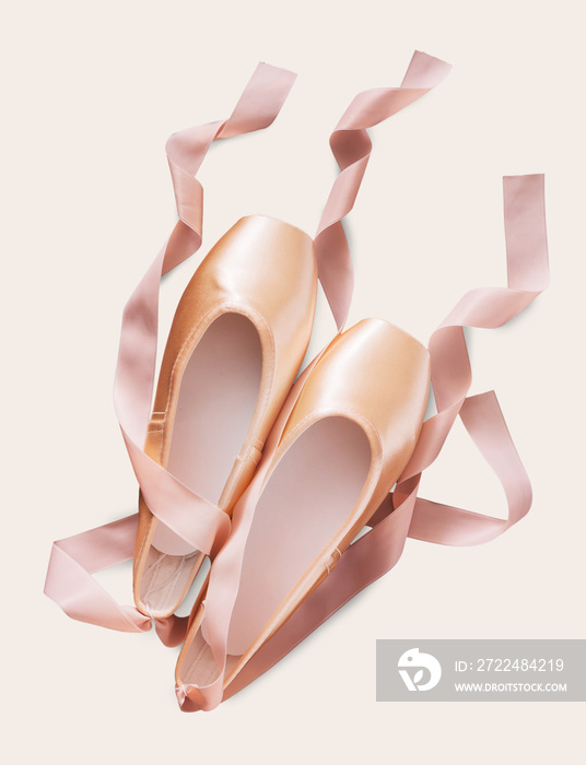 Pink ballet pointe shoes on white isolated background