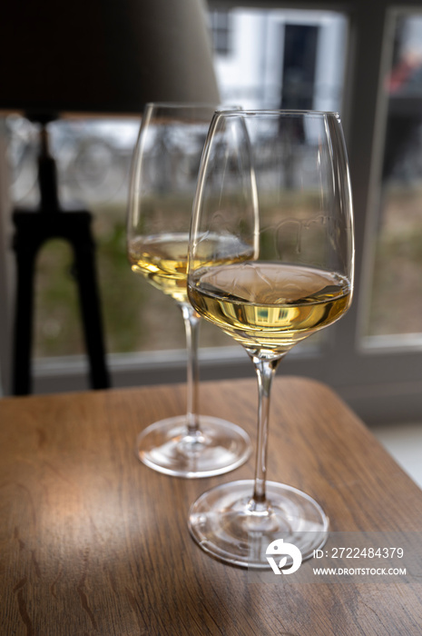 Two glasses of Chilean Chardonnay Viognier white wine served in cosy Dutch restaurant