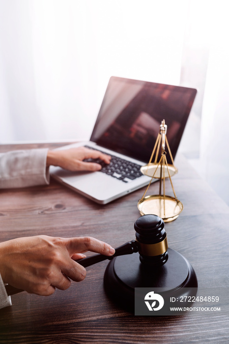 Business and lawyers discussing contract papers with brass scale on desk in office. Law, legal services, advice, justice and law concept