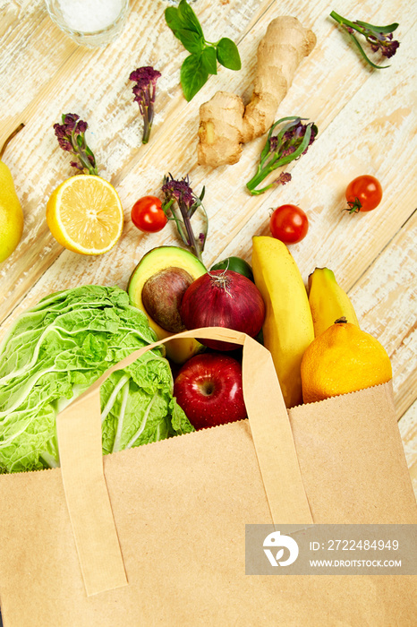 Grocering concept. Full paper bag of different fruits