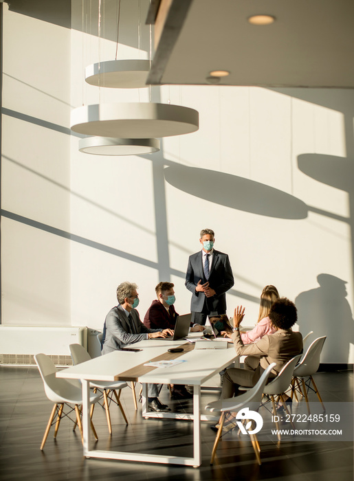 Group of business people have a meeting and working in office and wear masks as protection from corona virus