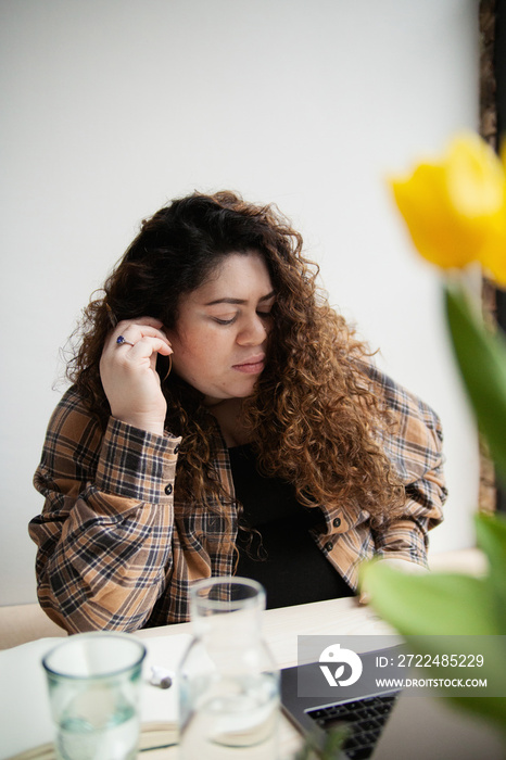 Plus-sized Sri Lankan woman with vitiligo working from home