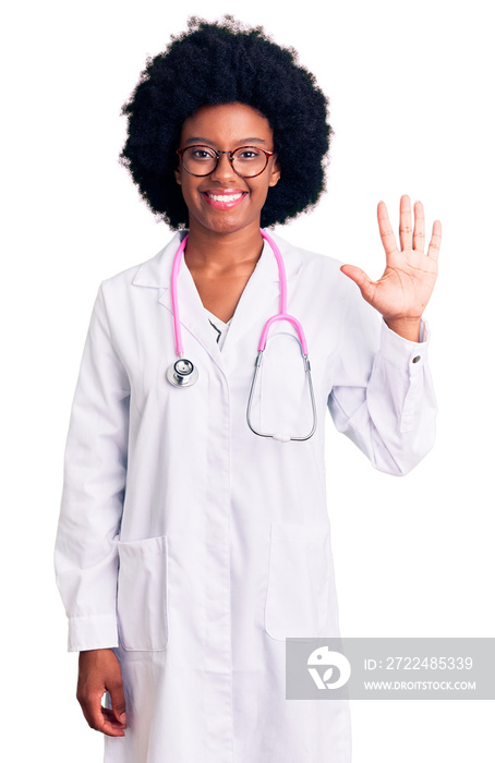 Young african american woman wearing doctor coat and stethoscope showing and pointing up with fingers number five while smiling confident and happy.