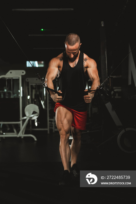 Man Doing Training On Machine For His Chest Muscle At The Gym