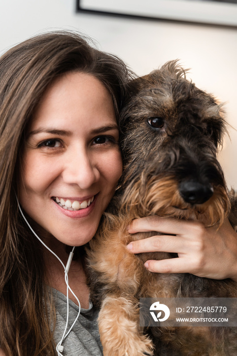 Portrait of happy woman and dog doing video call with mobile phone app - Online conference meeting concept