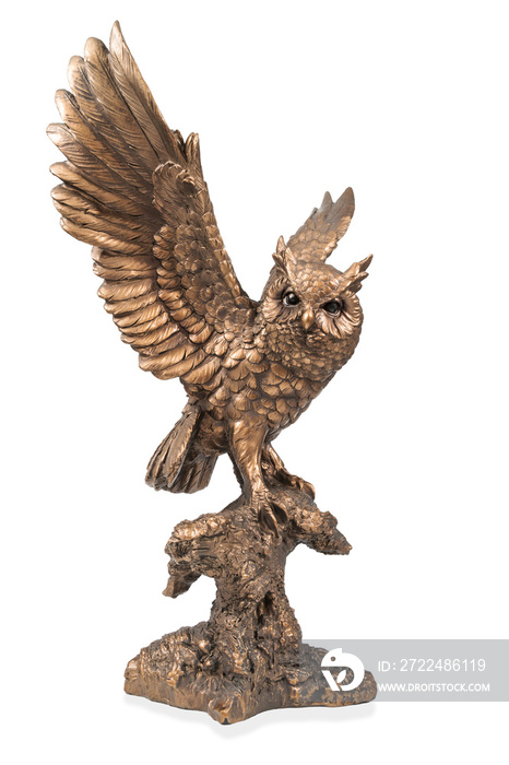 A bronze statuette of a flying owl with flapping wings isolated on white background