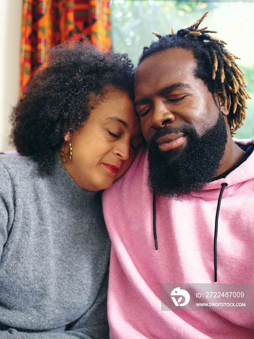 Couple embracing with eyes closed