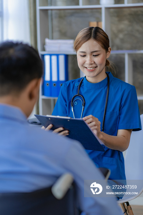 Asian female doctor talking to male patient consulting doctor is explaining she takes the result clearly in the medical office