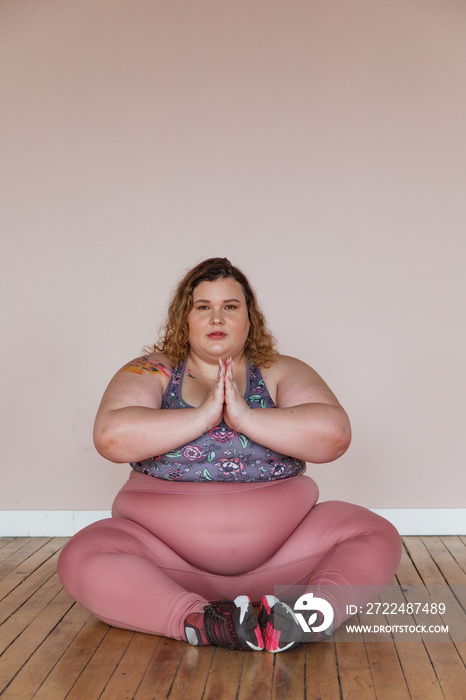 plus size woman practicing yoga