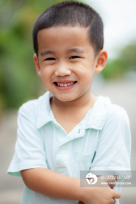 toothy smiling face of asian children happiness emotion