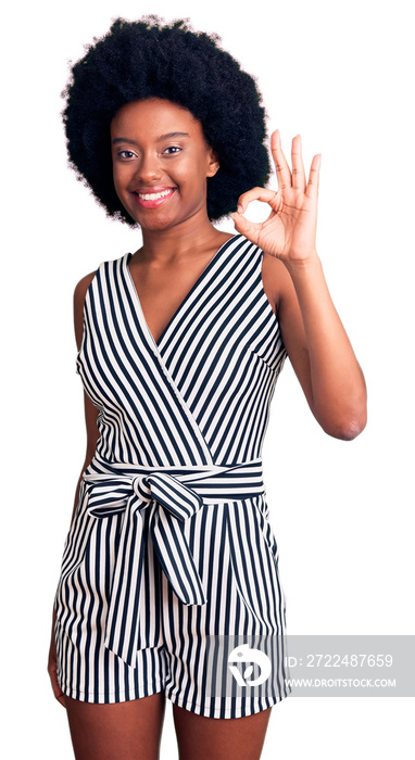 Young african american woman wearing casual clothes smiling positive doing ok sign with hand and fingers. successful expression.