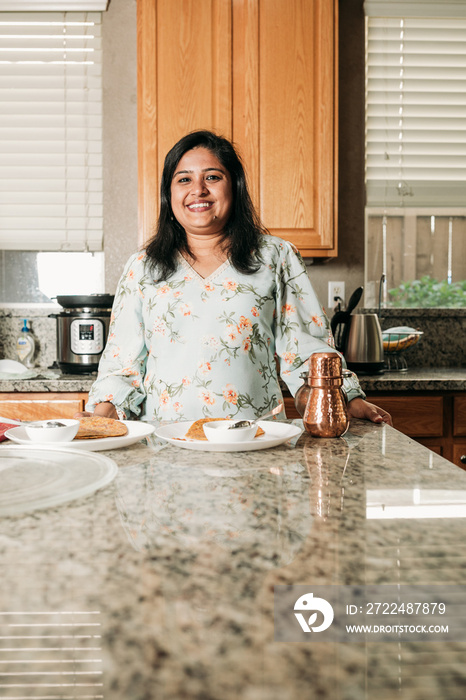 South Asian woman cooking in the Kitchen