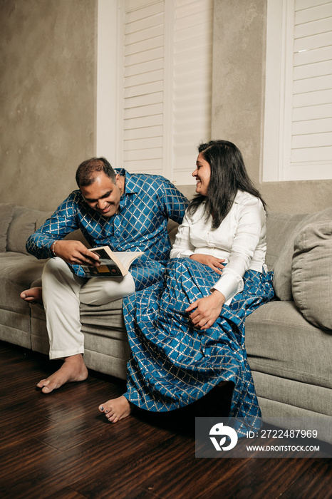 South Asian couple cooking in the Kitchen