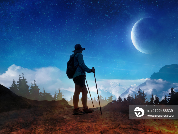 Double exposure photo with woman silhouette and night sky with mountains. Hiking and travel concept