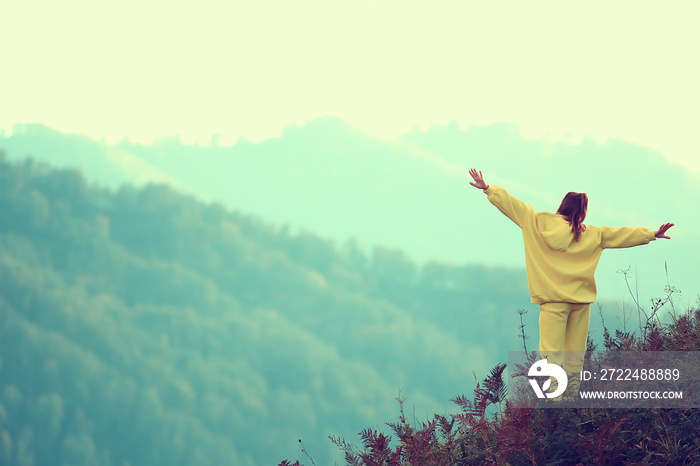 mountain girl raised her hands up, adventure, nature freedom female