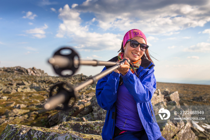 female hikers with trekking poles