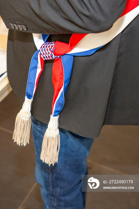 french man mayor tricolor blue white red scarf during an official celebration in france city hall