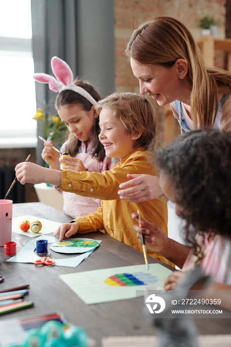 Children and teacher at art class