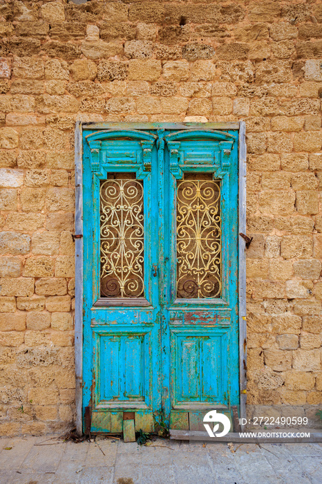 Broken ancient blue door