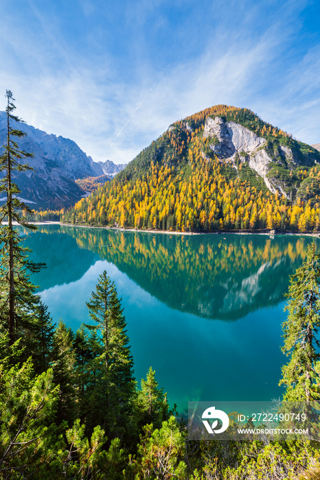 Autumn peaceful alpine lake Braies or Pragser Wildsee. Fanes-Sennes-Prags national park, South Tyrol, Dolomites Alps, Italy, Europe. Picturesque traveling, seasonal and nature beauty concept scene.