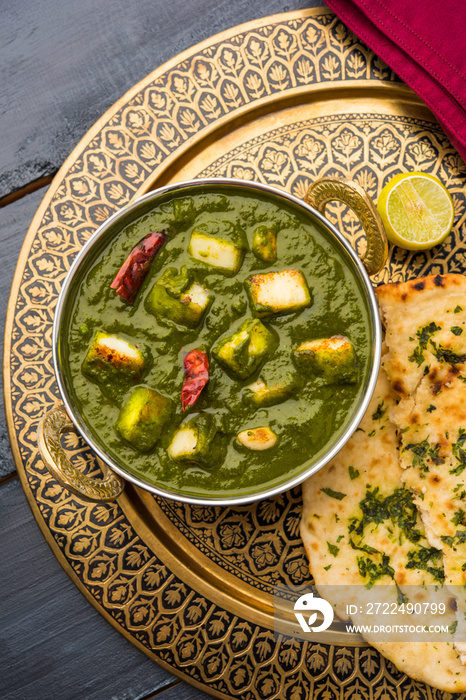 Indian curry dish - Palak paneer made up of  spinach and cottage cheese, served in ceramic bowl, selective focus