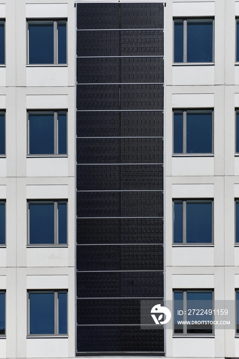 Solar panels on the facade of a residential building.