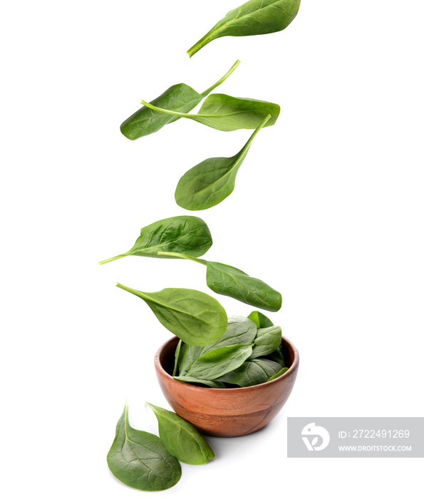 Bowl with fresh spinach on white background